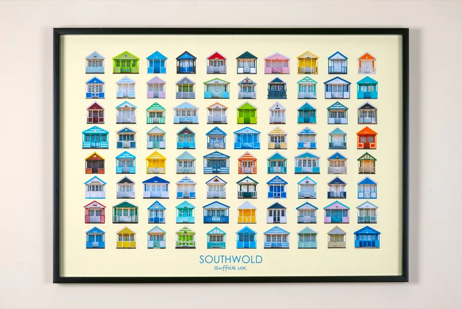 The landscape Southwold print in a slim black frame on a plain pale wall, photographed straight on
